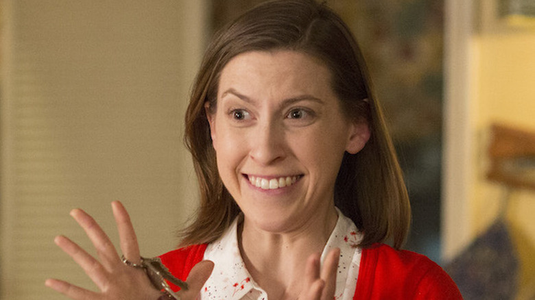 Sue Heck (Eden Sher) excitedly holds a set of keys in The Middle