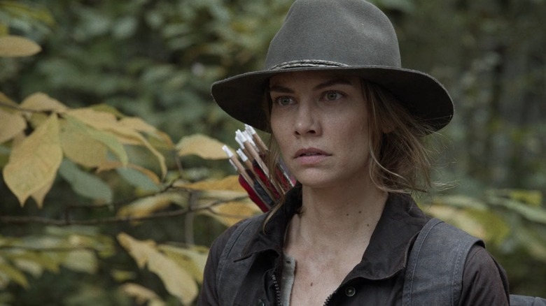 Lauren Cohan as Maggie on The Walking Dead, in the woods with a quiver of arrows on her back