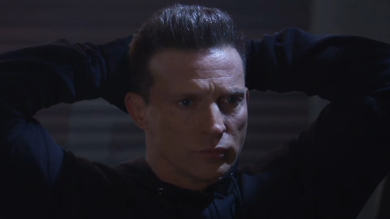 Steve Burton as Jason Morgan, his hands behind his head on General Hospital