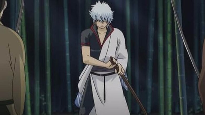 Gintoki Sakata prepares to draw his sword in a bamboo forest in Gintama