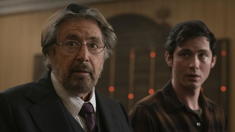 A bruised Jonah Heidelbaum (Logan Lerman) sitting next to Meyer Offerman (Al Pacino) in "Hunters"