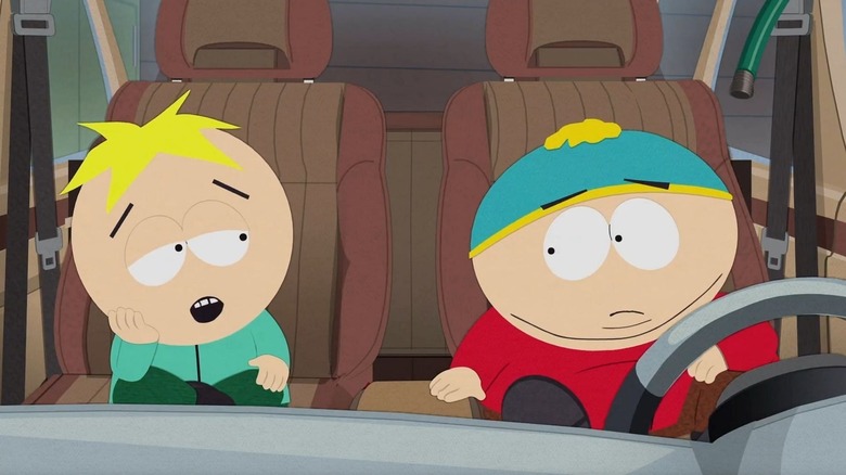 Butters Stotch (Matt Stone) sits in a car with Eric Cartman (Trey Parker) in South Park