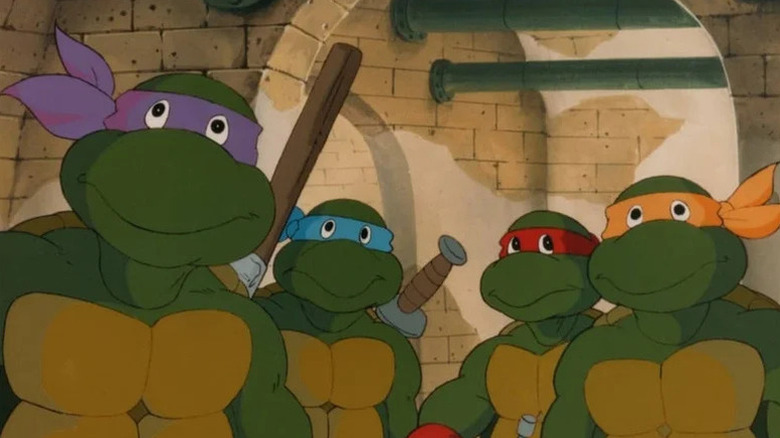 Donatello (Barry Gordon), Leonardo (Cam Clarke), Raphael (Rob Paulsen), and Michelangelo (Townsend Coleman) stand in the sewers in Teenage Mutant Ninja Turtles (1987)