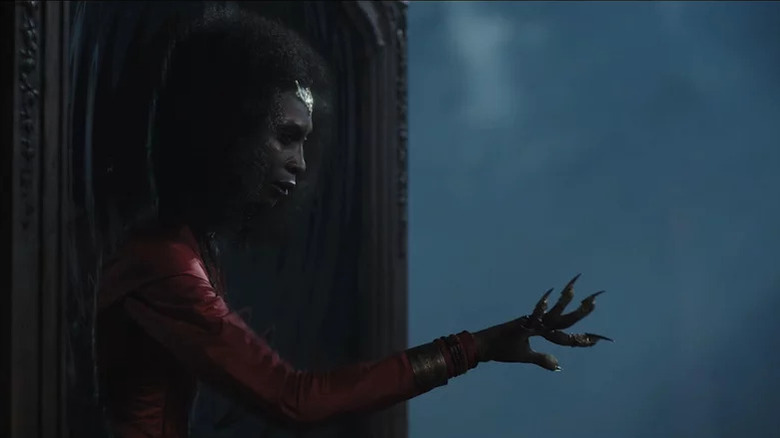Bloody Mary (Dominique Jackson) emerges from a mirror in American Horror Stories