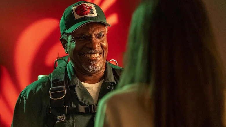 Mr. Murdoch grins sinisterly in his exterminator uniform in Creepshow