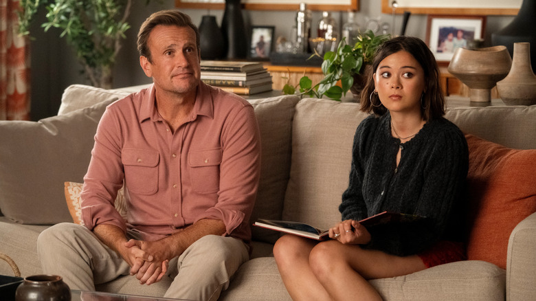 Jason Segel as Jimmy sitting on the couch next to Lukita Maxwell as Alice in Shrinking