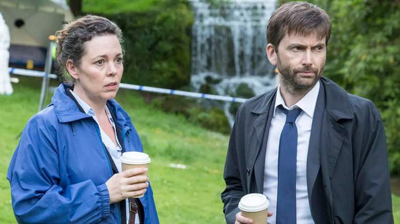Olivia Colman's Ellie Miller and David Tennant's Alec Hardy holding takeaway coffees on Broadchurch