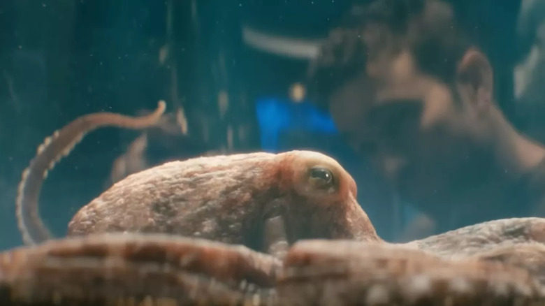 The Deep (Chace Crawford) peers into a water tank holding Ambrosius (Tilda Swinton) in The Boys