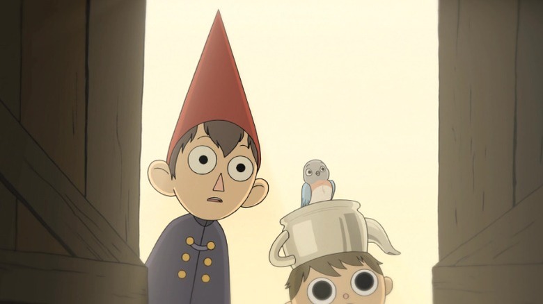 Wirt, Beatrice, and Greg looking through a barn door with shocked expressions on Over the Garden Wall episode 2