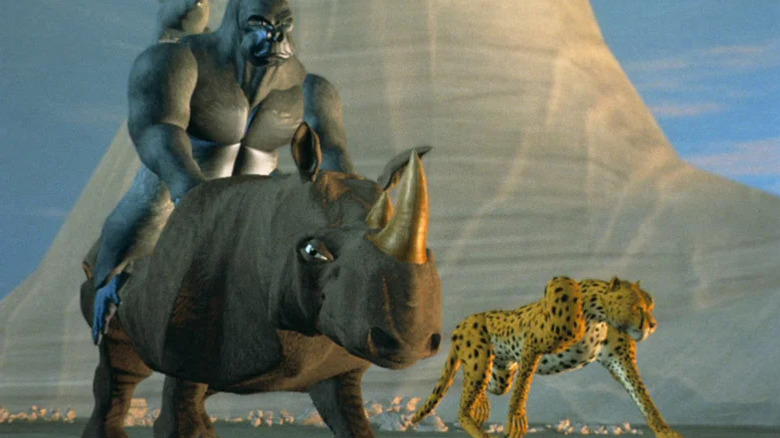 Optimus Primal (Garry Chalk) rides Rhinox (Richard Newman) while standing next to Cheetor (Ian James Corlett) in Transformers: Beast Wars