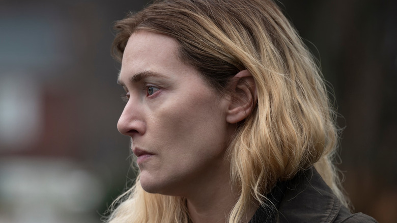 Kate Winslet as Mare Sheehan looks sad in Mare of Easttown