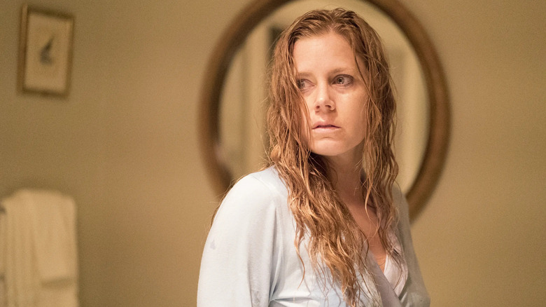 Amy Adams as Camille Preaker looks scared in Sharp Objects