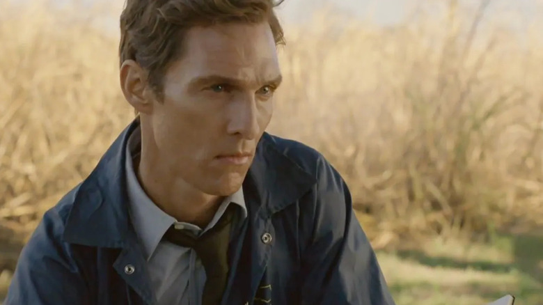 Matthew McConaughey as Rustin Cohle surveys a scene in True Detective