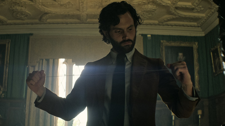 Joe Goldberg (Penn Badgley) examines a garroting wire in You