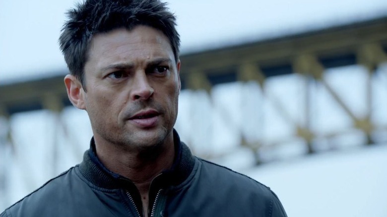 John Kennex (Karl Urban) stands outside near a bridge in "Almost Human."