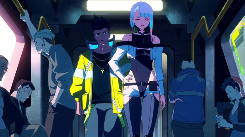 David Martinez walks in a subway car with Lucy Kushinada in Cyberpunk: Edgerunners