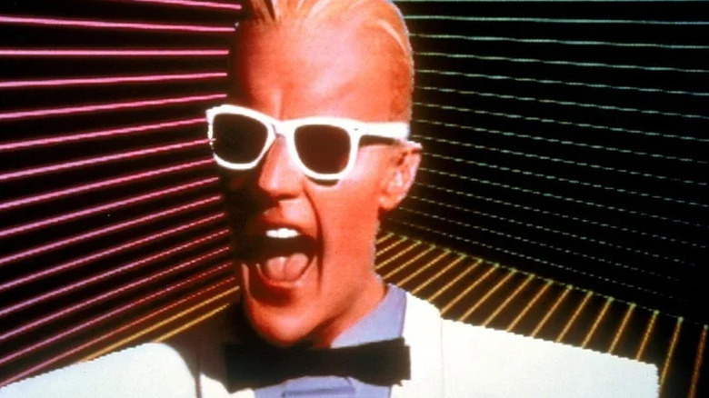 Max Headroom (Matt Frewer) shouts during a television broadcast in "Max Headroom."
