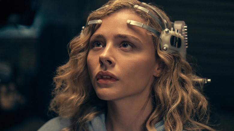 Flynne Fisher (Chloë Grace Moretz) wears a futuristic headset in "The Peripheral."