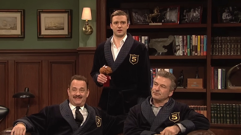 Justin Timberlake stands above Tom Hanks and Alec Baldwin in the Five Timers Club on SNL.