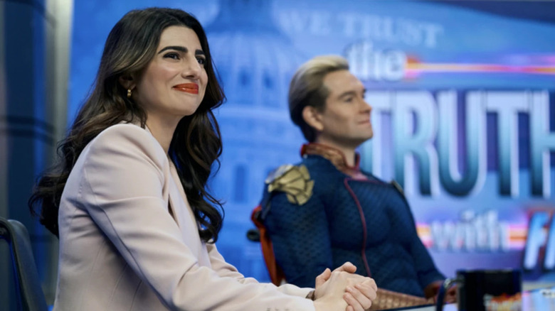 Victoria Neuman (Claudia Doumit) sits on a political talk show with Homelander (Antony Starr) in The Boys
