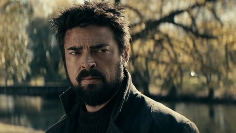 A distraught Billy Butcher (Karl Urban) stands by a pond in The Boys