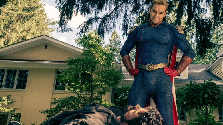 Homelander (Antony Starr) looking down at Butcher (Karl Urban) in The Boys