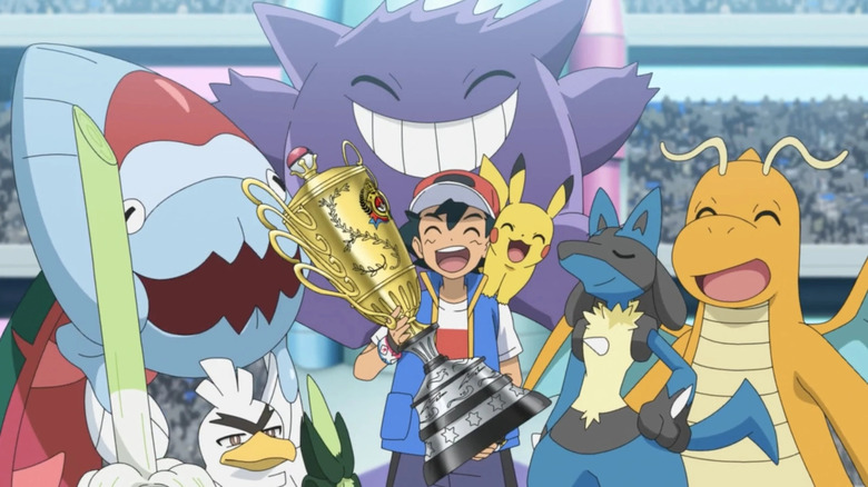 Dracovish, Sirfetch'd, Gengar, Pikachu, Lucario, and Dragonite smiling while Ash holds the championship trophy in the Pokemon anime