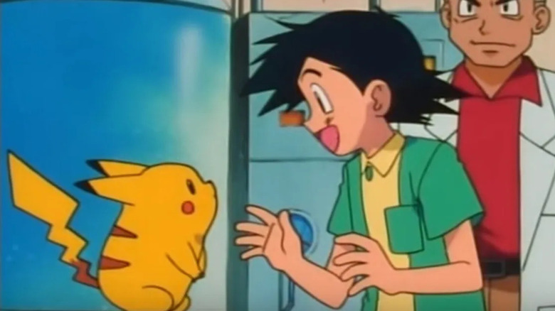 Ash in his pajamas meeting Pikachu in Oak's lab in the Pokemon anime