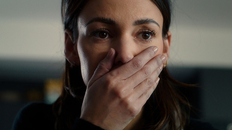 Maya Burkett (Michelle Keegan) covers her mouth in shock in Fool Me Once
