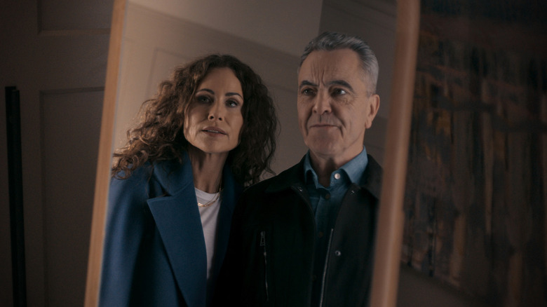 Ingrid Greene (Minnie Driver) and Simon Greene (James Nesbitt) stare at themselves in a mirror in Run Away