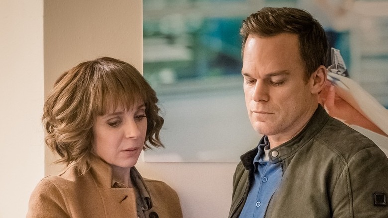 Sophie Mason (Amanda Abbington) and Tom Delaney (Michael C. Hall) stare down at something in Safe