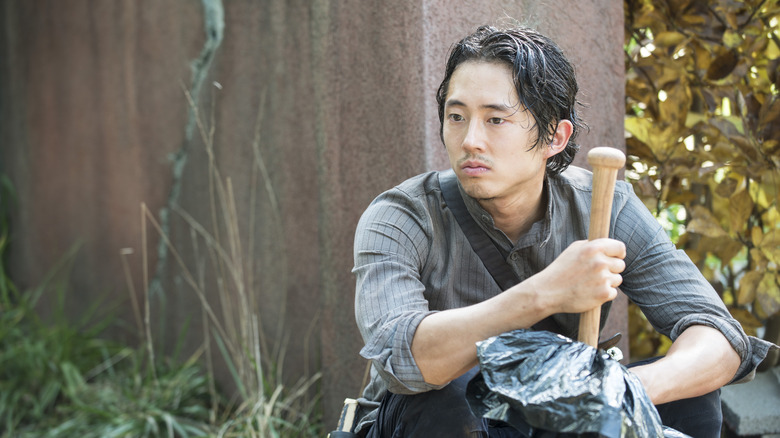 Glenn holding baseball bat