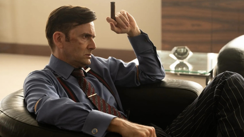 David Tennant as Tony, sitting angrily in a chair in Rivals.