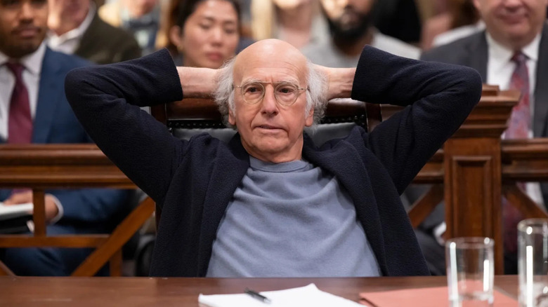 Larry David leaning back in a courtroom in Curb Your Enthusiasm