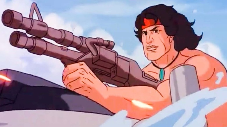 John Rambo holds gun in Rambo: The Force of Freedom
