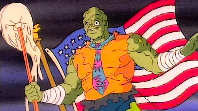 The Toxic Avenger in front of a flag in Toxic Crusaders