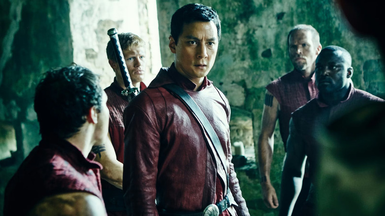 Sunny (Daniel Wu) stands surrounded by rival warriors in Into the Badlands