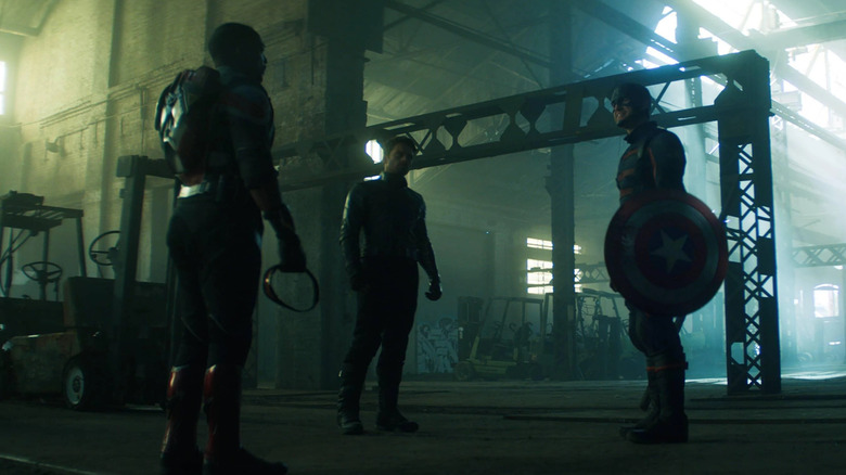 Anthony Mackie as Sam Wilson facing Sebastian Stan as Bucky Barnes and Wyatt Russell as John Walker with Captain America's shield in The Falcon and the Winter Soldier