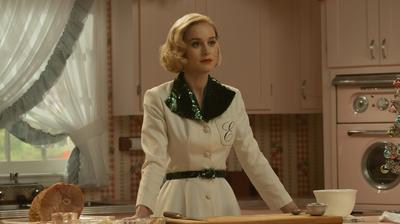 Brie Larson as Elizabeth Zott, on her kitchen set in Lessons in Chemistry.