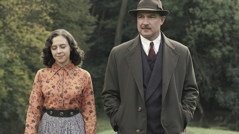 Bel Powley as Miep Gies standing next to Liev Schreiber as Otto Frank in A Small Light