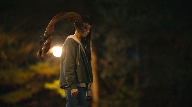 Jeon So-nee as Su-in, with parasitic creature coming out of her face in Parasyte: The Grey
