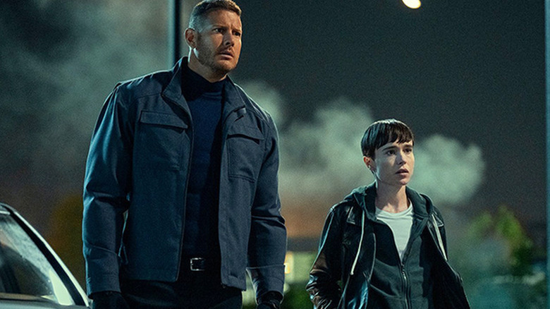 Tom Hopper as Luther standing next to Elliot Page as Viktor in The Umbrella Academy