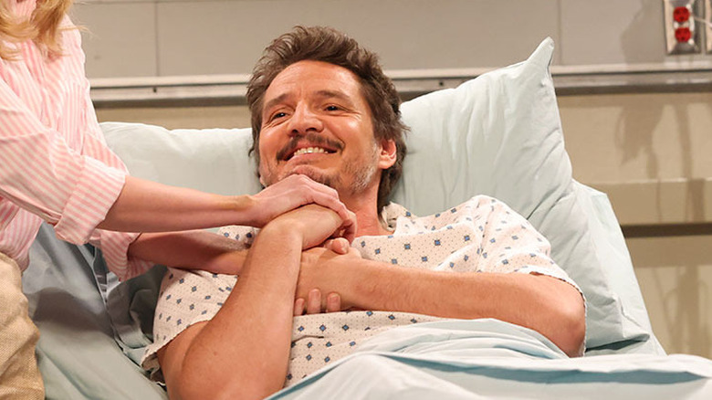 Pedro Pascal holding Heidi Gardner's hands in a hospital bed on SNL