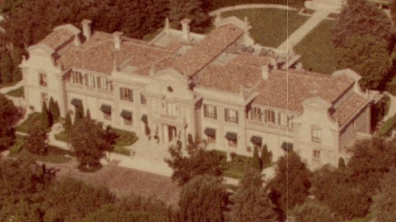 An overview shot of a big mansion in the Succession intro