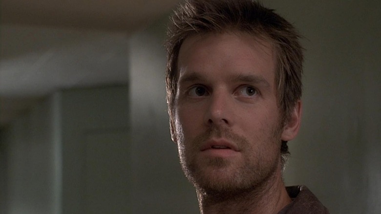 Nate Fisher (Peter Krause) stands in a funeral home in Six Feet Under