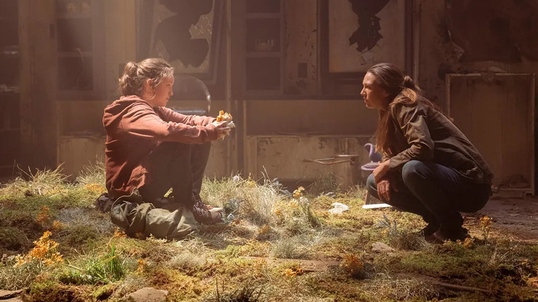 Ellie (Bella Ramsey) speaks with Tess (Anna Torv) in The Last of Us