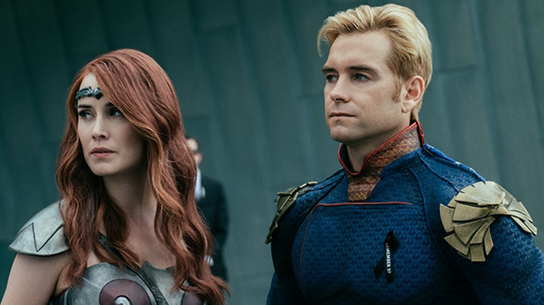 Dominique McElligott as Queen Maeve in Amazonian costume next to Antony Starr as Homelander in blue superhero suit in The Boys
