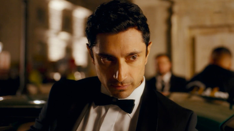 Riz Ahmed as Shah Latif looks down, playing James Bond in Bait.