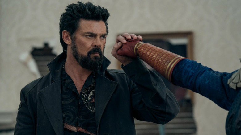 Karl Urban as Billy Butcher, blocking Homelander's punch in The Boys.