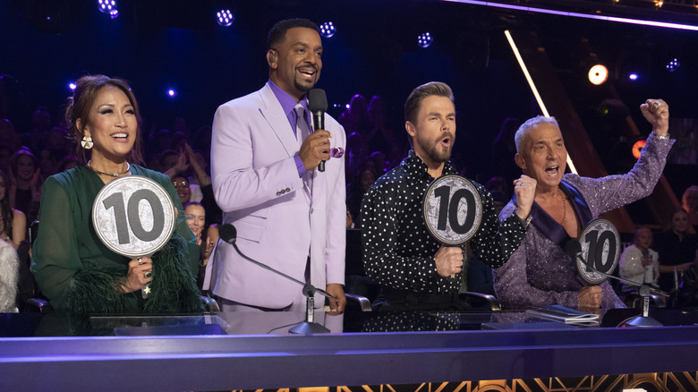 Carrie Ann Inaba, Derek Hough and Bruno Tonioli give scores while Alfonso Ribeiro hosts Dancing With the Stars